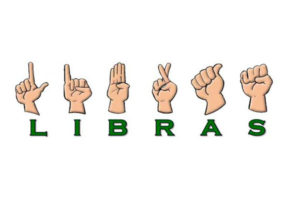 Imagem de mãos reproduzindo a palavra libras na Língua Brasileira de Sinais