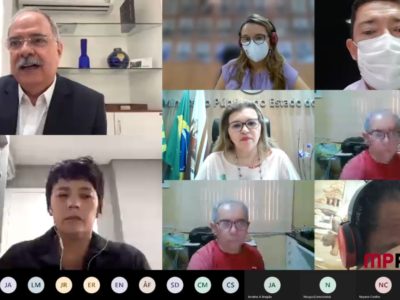 Foto da reunião retirada da tela do computador. Centralizada na imagem a PGJ, Carmelina Moura, e ao redor as demais autoridades.